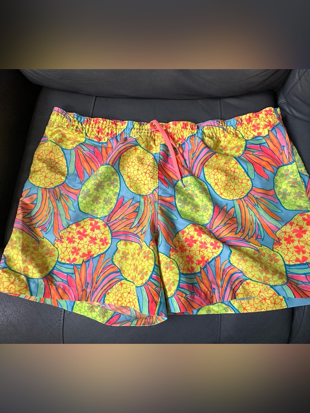 Chubbies "The Hooligans" swim trunks featuring a vibrant neon pineappl